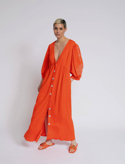 Red orange dress with embroidery on the sleeves