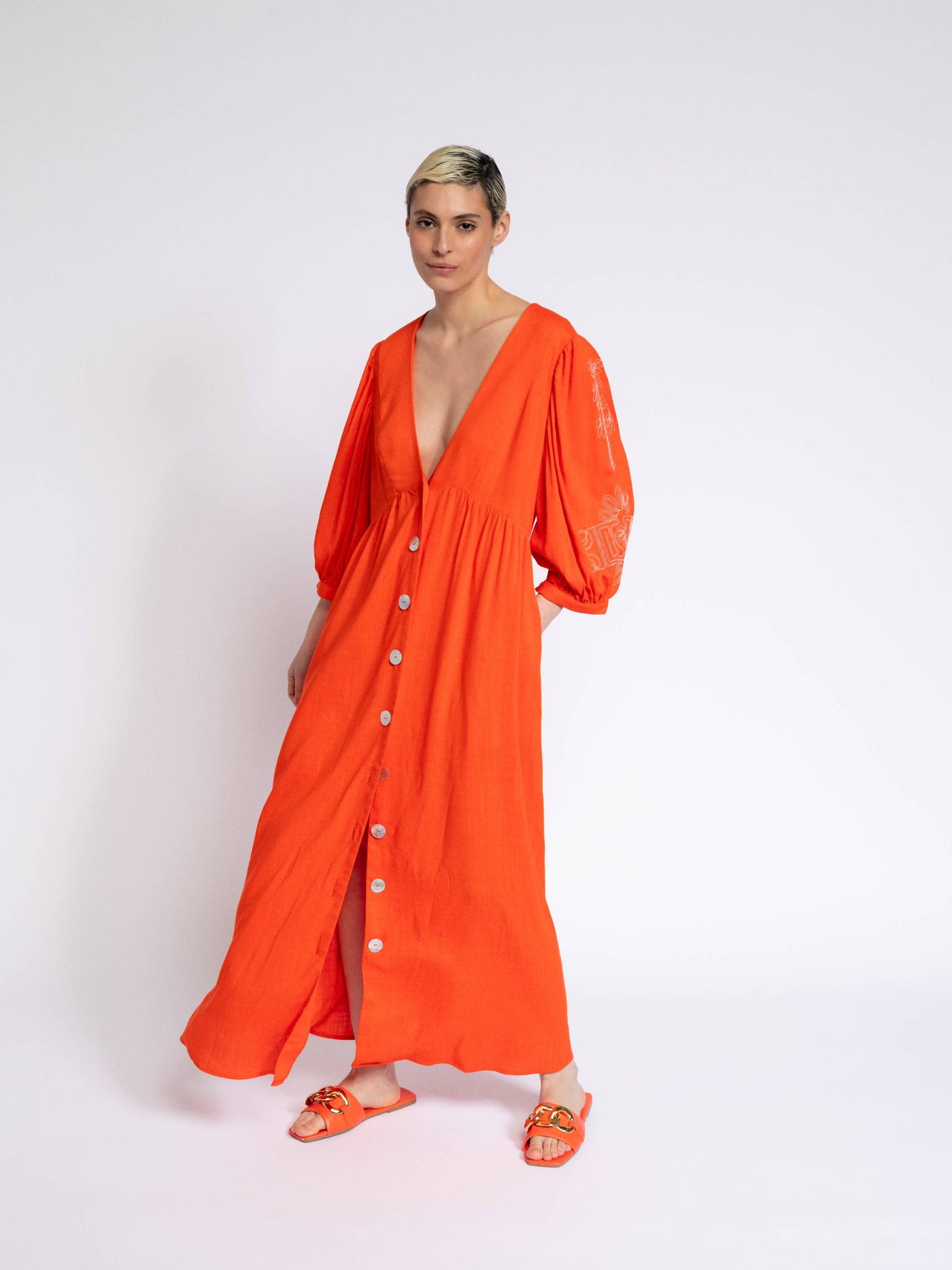 Red orange dress with embroidery on the sleeves